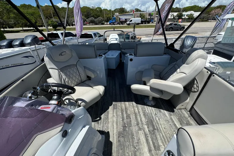 Slide: The Image of Interior of a 2020 Crest Savannah 250 SLRC boat with luxurious seating and steering wheel. - 6