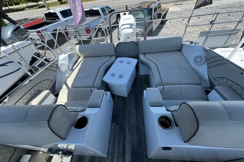 Slide: The Image of 2020 Crest Savannah 250 SLRC boat interior with plush seating and cup holders. - 8