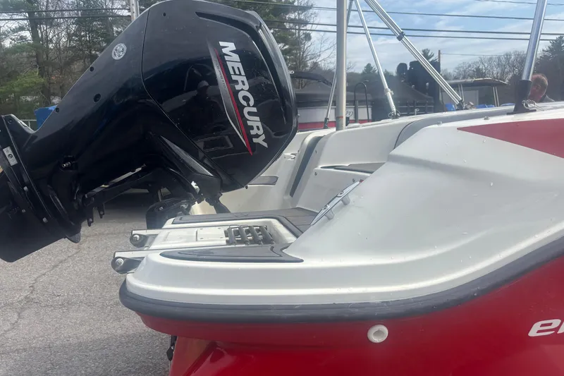 Slide: The Image of 2023 Bayliner Element E17 boat with Mercury outboard motor, red and white design. - 10