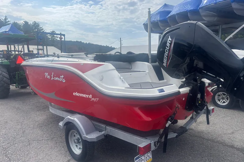Slide: The Image of 2023 Bayliner Element E17 boat with Mercury engine on trailer. - 2