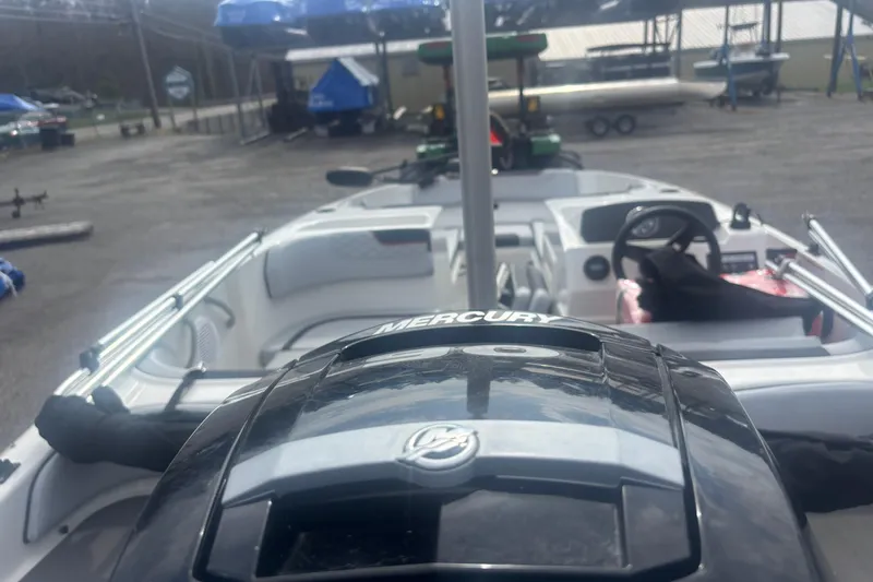 Slide: The Image of 2023 Bayliner Element E17 boat with Mercury engine, docked at marina. - 4