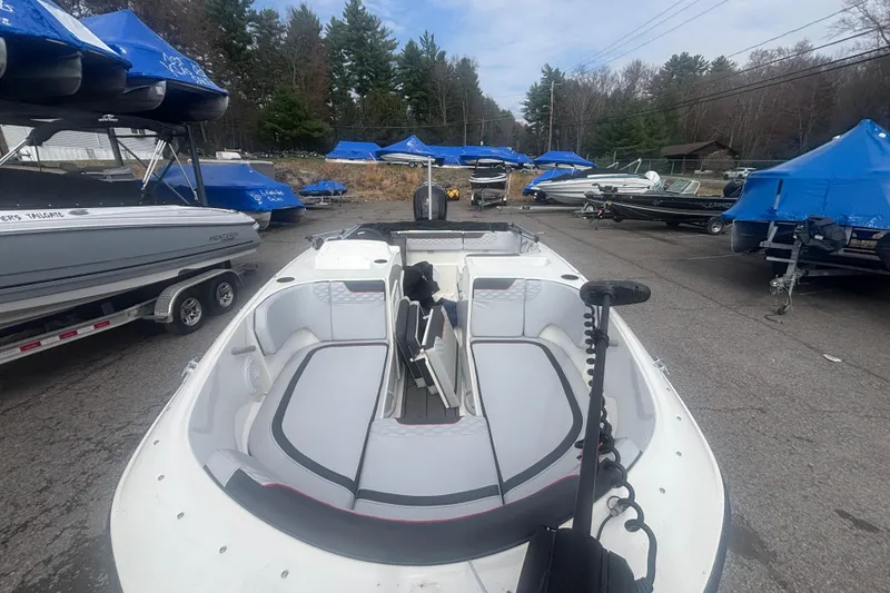 Slide: The Image of 2023 Bayliner Element E17 boat in a marina with other boats. - 7