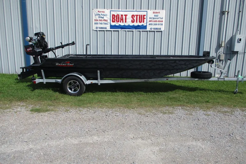 The Image of 2026 Gator Tail 1854 Extreme boat on trailer outside a metal building. - 0