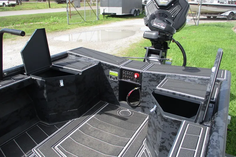Slide: The Image of 2026 Gator Tail 1854 Extreme boat interior with storage compartments and control panel. - 7