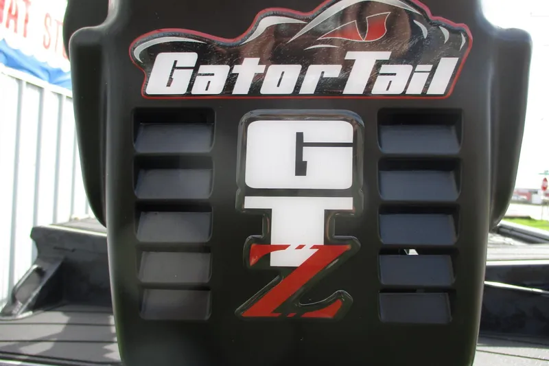 Slide: The Image of Close-up of 2026 Gator Tail 1854 Extreme logo on a boat motor. - 9