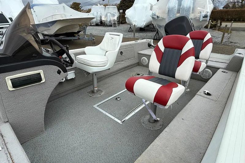 Slide: The Image of 2008 Starcraft Starfire 1700 SC boat interior with red and white seating. - 3