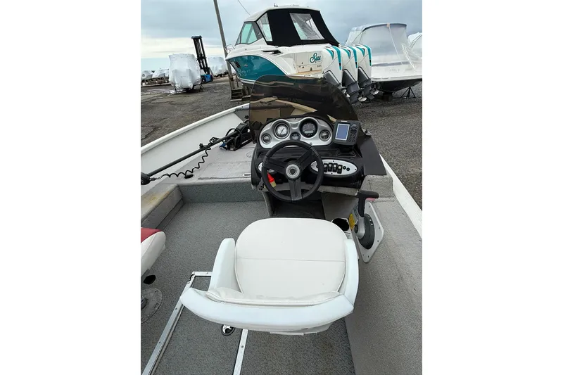 Slide: The Image of 2008 Starcraft Starfire 1700 SC boat interior with steering console and seating. - 4