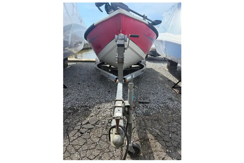 Slide: The Image of 2008 Starcraft Starfire 1700 SC boat on trailer, parked on gravel. - 8