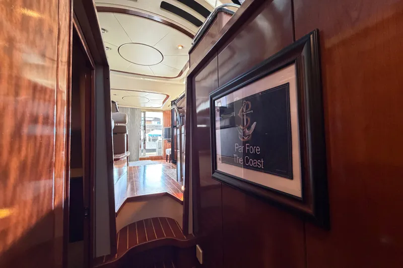 Slide: The Image of Interior of 2009 Meridian 441 Sedan yacht with elegant wood paneling and framed artwork. - 10