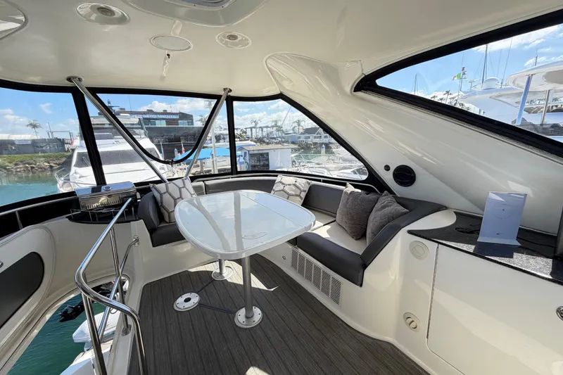 Slide: The Image of Luxurious interior of a 2009 Meridian 441 Sedan yacht with elegant seating and panoramic windows. - 26