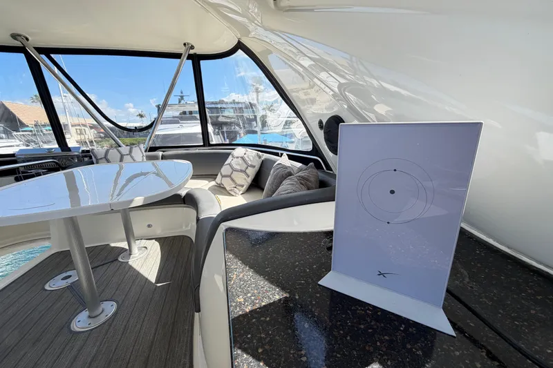 Slide: The Image of Luxurious interior of 2009 Meridian 441 Sedan yacht with modern seating and table. - 27