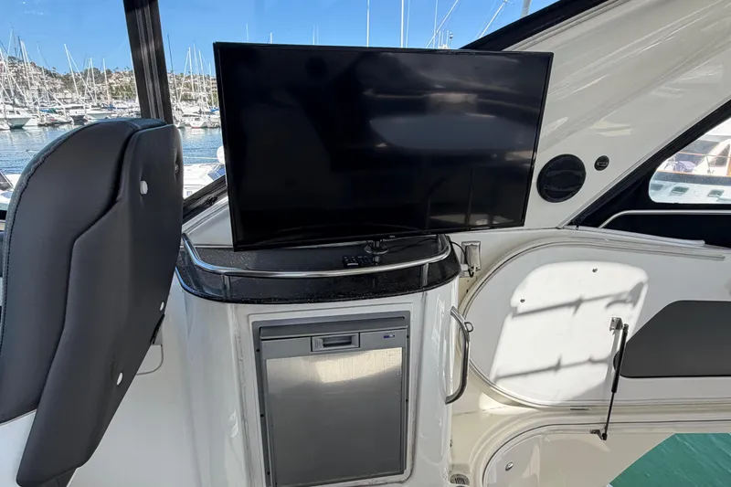 Slide: The Image of Interior of a 2009 Meridian 441 Sedan yacht with TV and mini-fridge. - 29