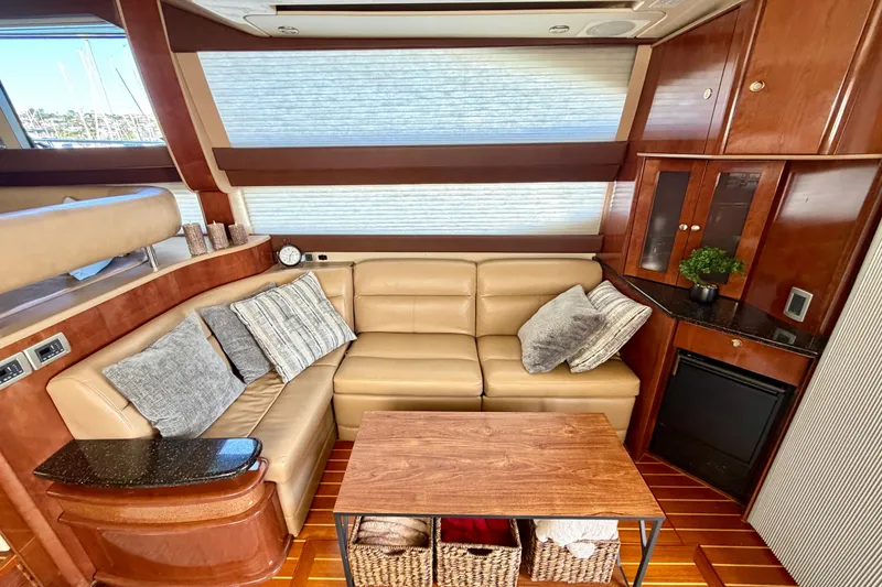 Slide: The Image of Luxurious interior of 2009 Meridian 441 Sedan yacht with leather seating and wooden accents. - 3