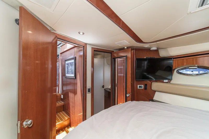 Slide: The Image of Luxurious interior of 2009 Meridian 441 Sedan yacht with wood finishes and modern amenities. - 34
