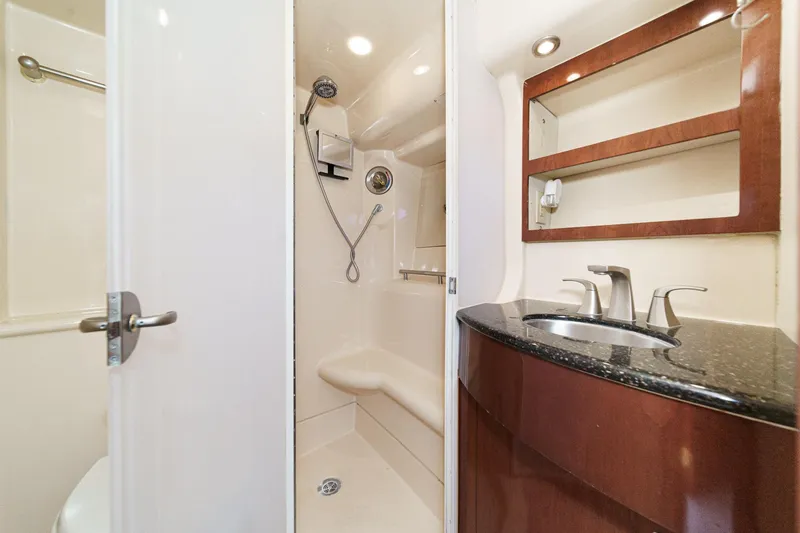 Slide: The Image of Luxurious bathroom in 2009 Meridian 441 Sedan yacht with modern fixtures and elegant design. - 35