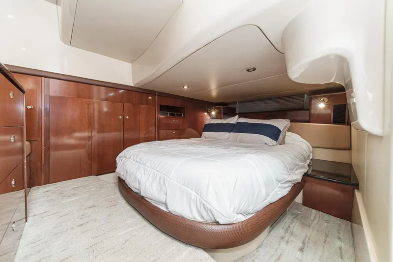 Slide: The Image of Luxurious bedroom interior of 2009 Meridian 441 Sedan yacht with elegant wood finishes. - 36