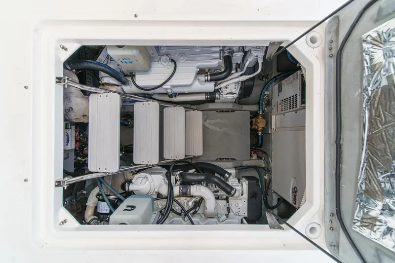 Slide: The Image of Engine compartment of a 2009 Meridian 441 Sedan, showcasing mechanical components and wiring. - 39