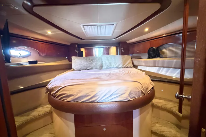 Slide: The Image of Luxurious bedroom interior of 2009 Meridian 441 Sedan yacht with elegant wood finishes. - 8