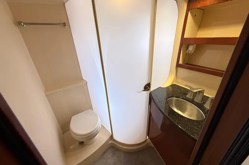 Slide: The Image of Compact bathroom in 2009 Meridian 441 Sedan yacht with shower, toilet, and sink. - 9