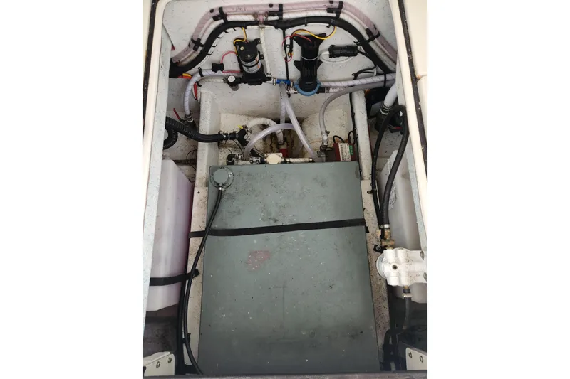 Slide: The Image of Engine compartment of a 2018 Atlas Acadia boat, showing fuel tank and plumbing. - 13