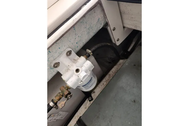 Slide: The Image of Fuel filter system in a 2018 Atlas Acadia boat, mounted on a white panel. - 14