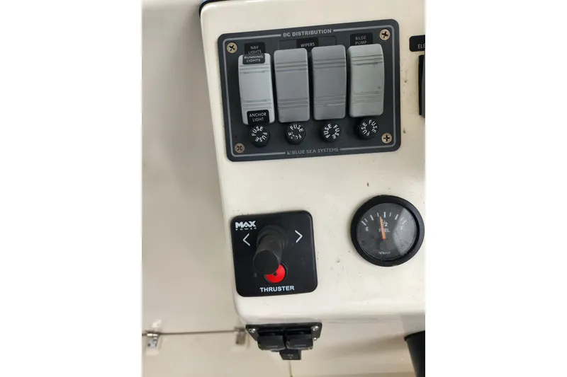 Slide: The Image of Control panel of a 2018 Atlas Acadia boat with switches and fuel gauge. - 16