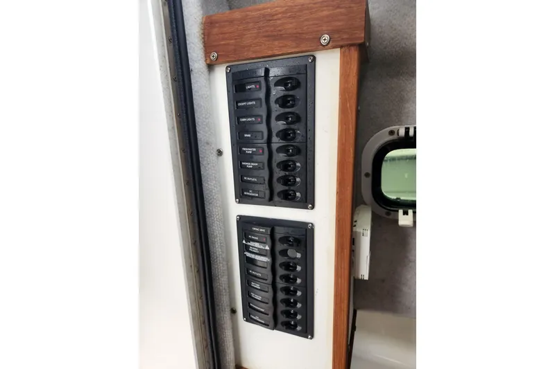 Slide: The Image of Electrical panel with labeled switches in a 2018 Atlas Acadia boat interior. - 17