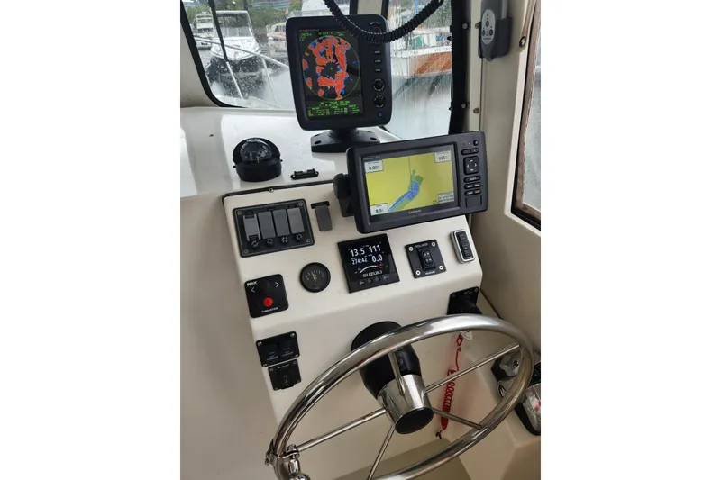Slide: The Image of Boat cockpit with navigation screens and controls, Atlas Acadia 2018 model. - 3