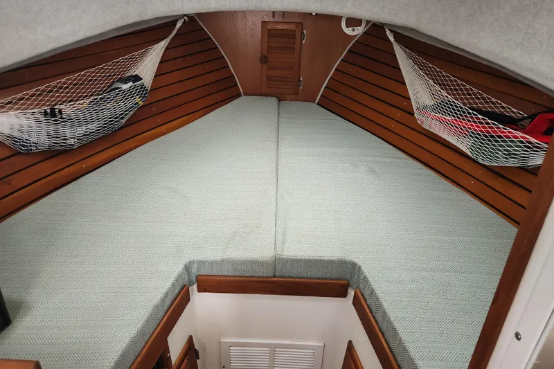 Slide: The Image of Cozy cabin interior of 2018 Atlas Acadia with wooden accents and netted storage. - 7