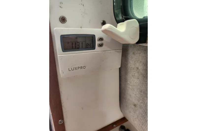 Slide: The Image of LuxPro thermostat displaying temperature, mounted on a wall inside a 2018 Atlas Acadia. - 9