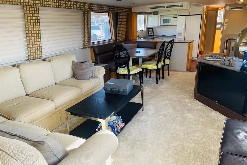 Slide: The Image of Luxurious interior of a 1991 Hatteras 70 Cockpit Motor Yacht with elegant furnishings. - 12