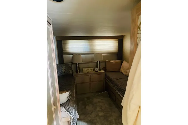Slide: The Image of Interior cabin of 1991 Hatteras 70 Cockpit Motor Yacht with cozy twin beds. - 13