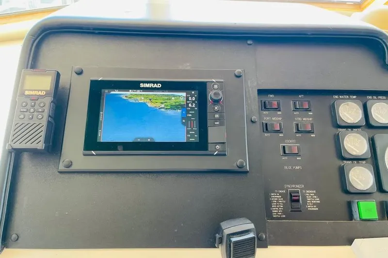 Slide: The Image of Control panel of a 1991 Hatteras 70 Cockpit Motor Yacht with Simrad navigation system. - 15