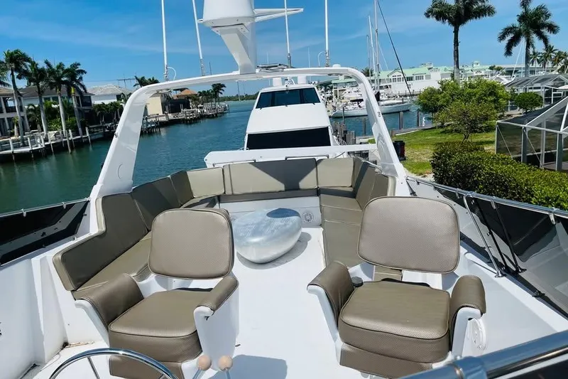 Slide: The Image of Luxurious 1991 Hatteras 70 Cockpit Motor Yacht with spacious outdoor seating area. - 19