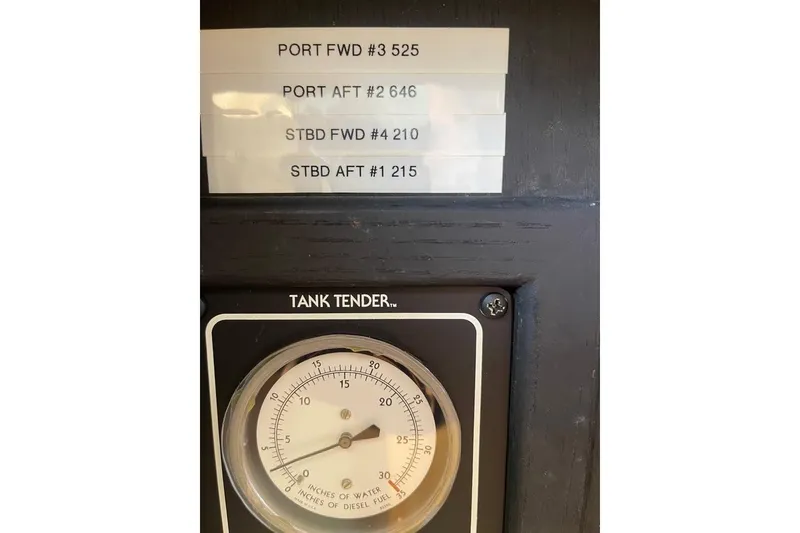 Slide: The Image of Tank Tender gauge on 1991 Hatteras 70 Cockpit Motor Yacht dashboard. - 9