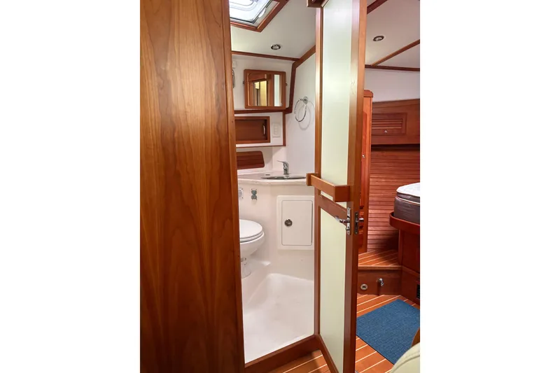 Slide: The Image of Interior of 2020 Sabre 42 Salon Express yacht bathroom with wooden accents. - 18
