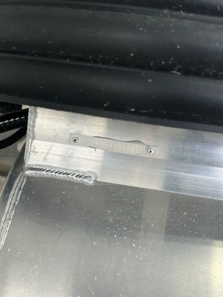 Slide: The Image of Close-up of a 2024 Lowe SS214 boat detail with serial number. - 14