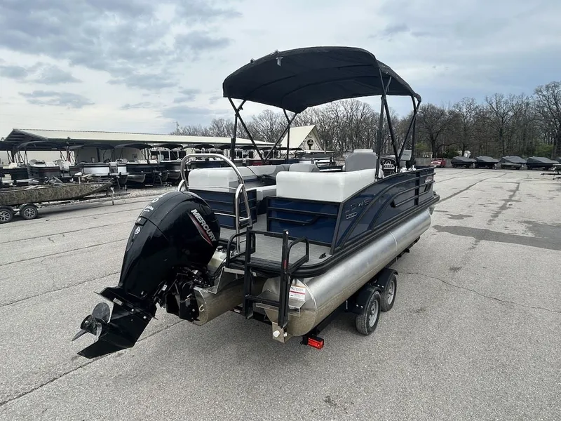 Slide: The Image of 2024 Lowe SS214 pontoon boat with outboard motor on trailer. - 15