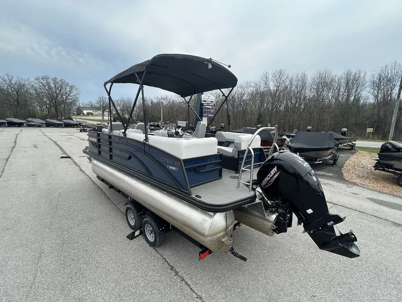 Slide: The Image of 2024 Lowe SS214 pontoon boat with outboard motor on trailer. - 3