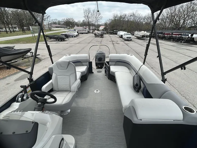 Slide: The Image of 2024 Lowe SS214 pontoon boat with spacious interior and seating. - 7