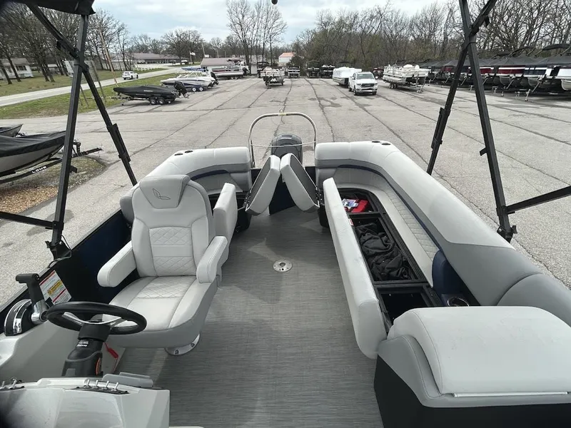 Slide: The Image of Interior view of a 2024 Lowe SS214 pontoon boat in a parking lot. - 8