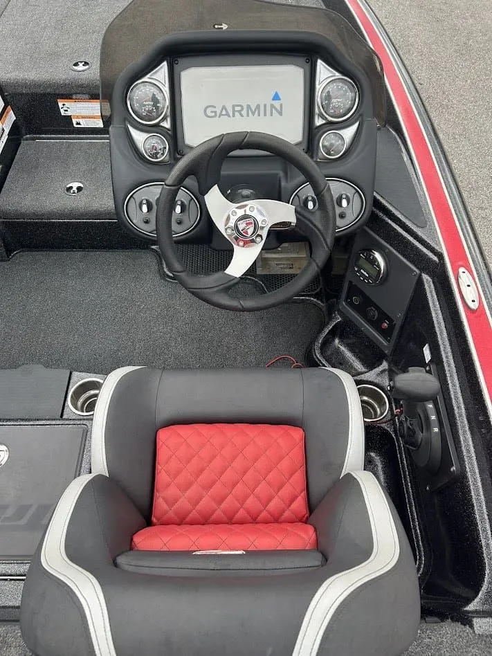 Slide: The Image of Interior of 2021 Triton 18TRX with Garmin display and red seat. - 12