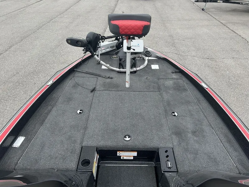 Slide: The Image of 2021 Triton 18TRX boat with gray deck and red seat. - 13