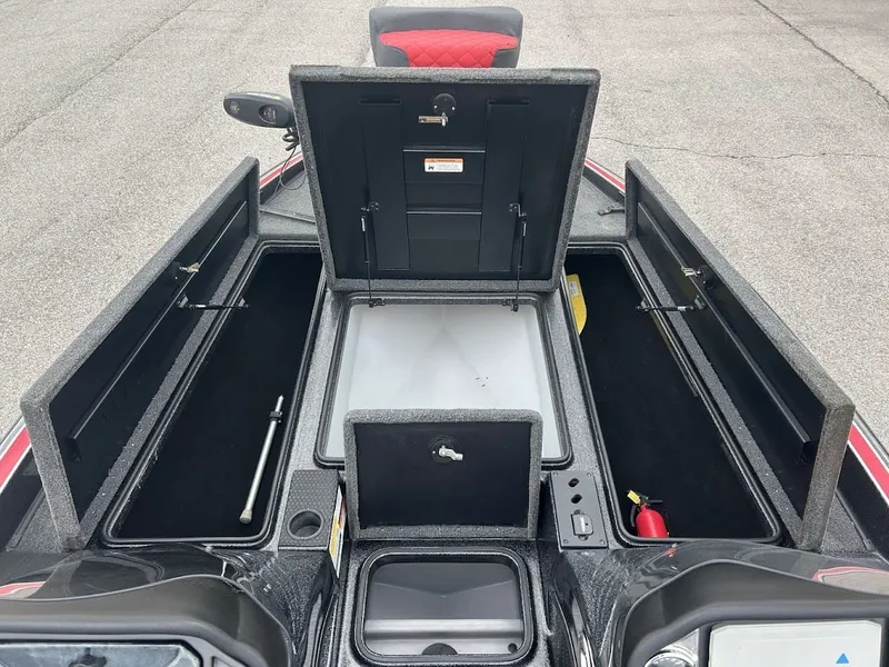 Slide: The Image of Interior view of a 2021 Triton 18TRX boat with storage compartments. - 14