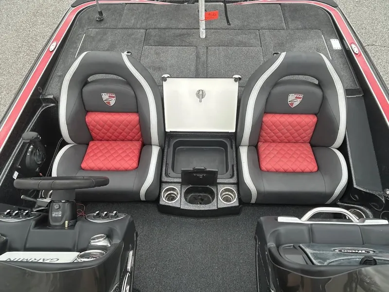 Slide: The Image of Interior of a 2021 Triton 18TRX boat with red seats. - 17