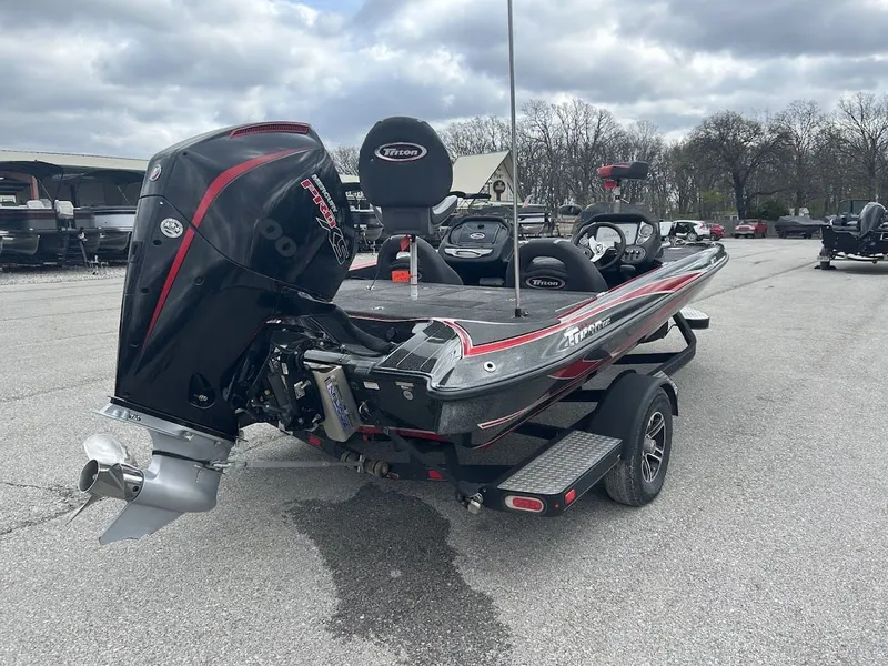 Slide: The Image of 2021 Triton 18TRX boat with powerful outboard motor. - 7