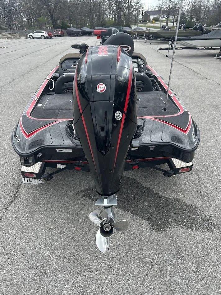 Slide: The Image of Rear view of a 2021 Triton 18TRX boat in a parking lot. - 8