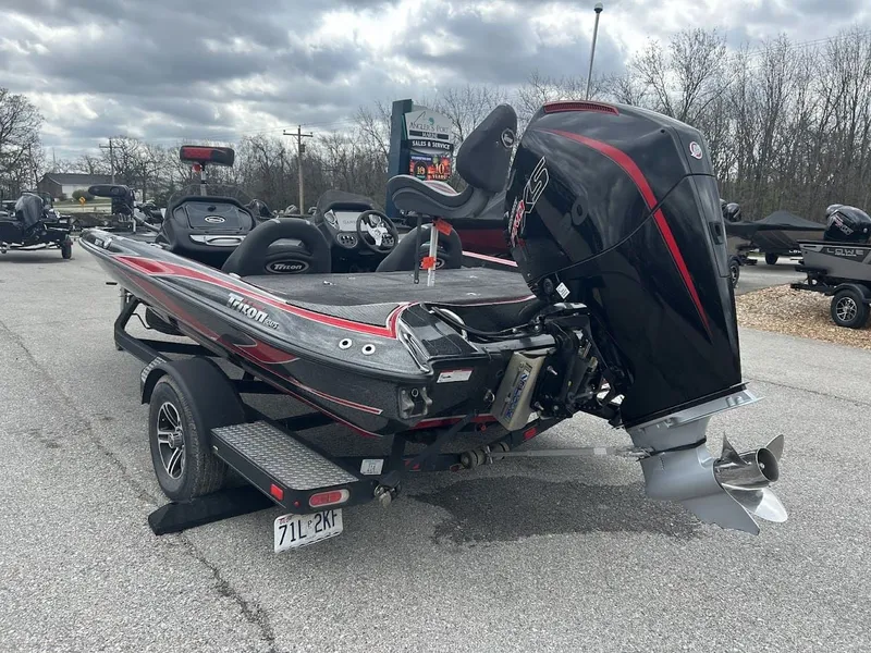 Slide: The Image of 2021 Triton 18TRX boat with powerful outboard motor. - 9