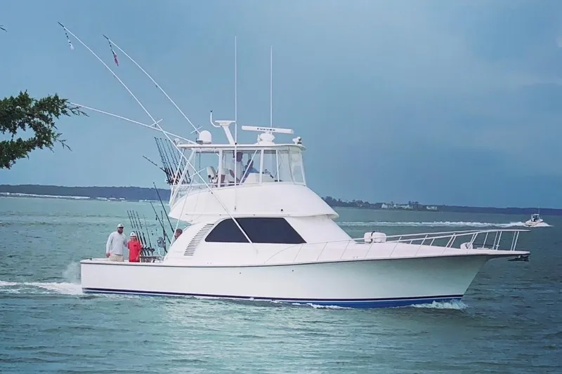 The Image of 2011 Henriques 42 Flybridge yacht cruising on open water. - 0