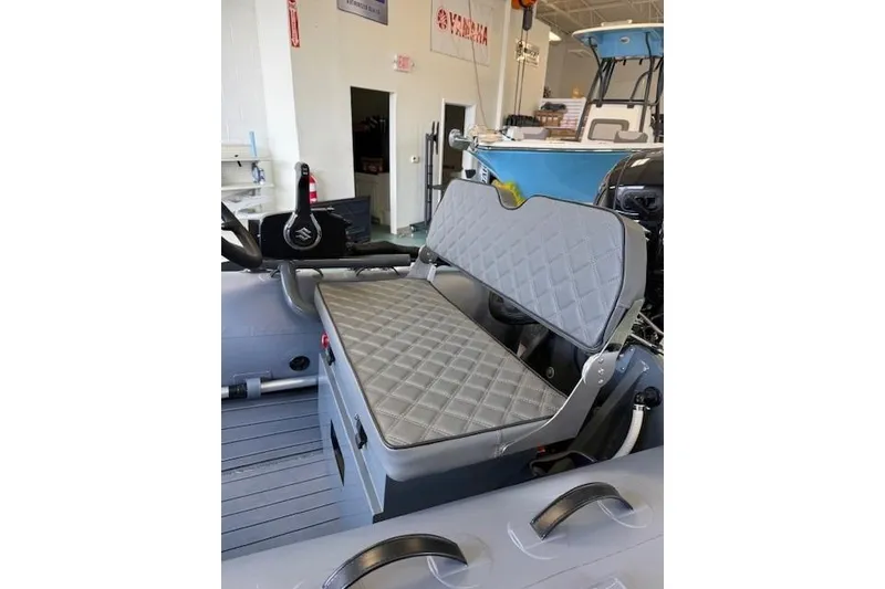 Slide: The Image of Gray quilted seat in Desner CL 360 FCT boat, showroom setting, 2026 model. - 10